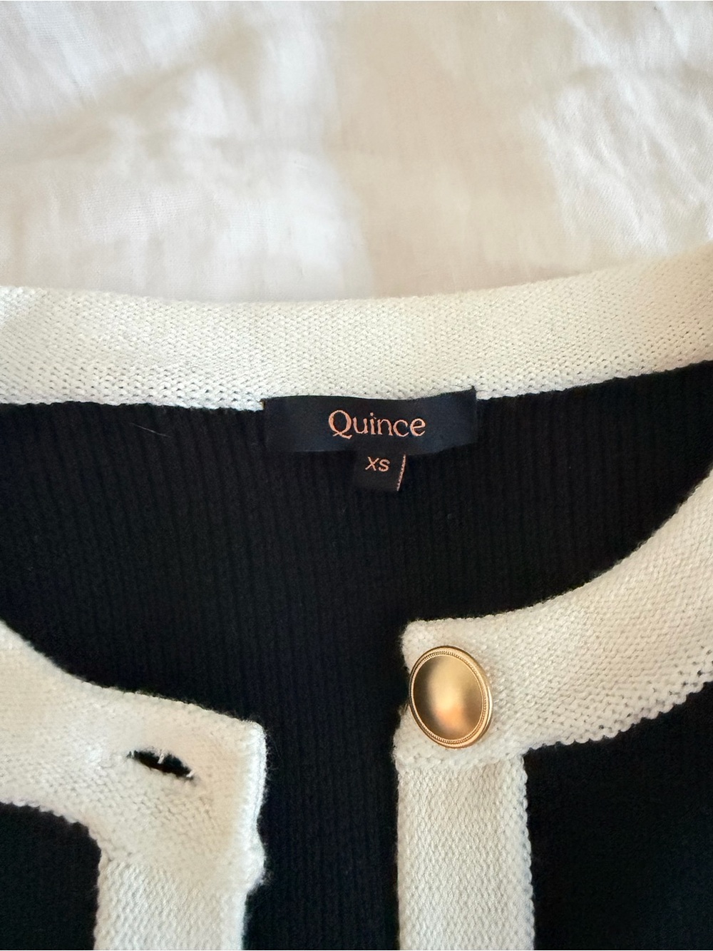 Quince Black Cardigan with White Trim and Gold Button - Picture 2 of 4